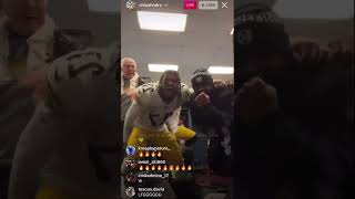 Steelers coach Mike Tomlin dancing and celebrating with players in the locker room after Ravens win
