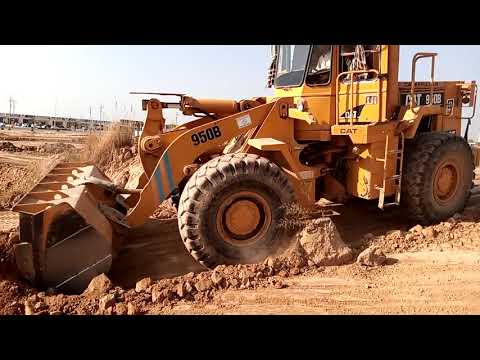 Caterpillar 992G Wheel Loader Loading Caterpillar 777C Dumper.