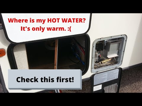 No Hot water, just warm water?  You forgot to do this most likely. Suburban Hot Water Heater issues.