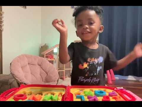 Zamira with Elmo on to go letters