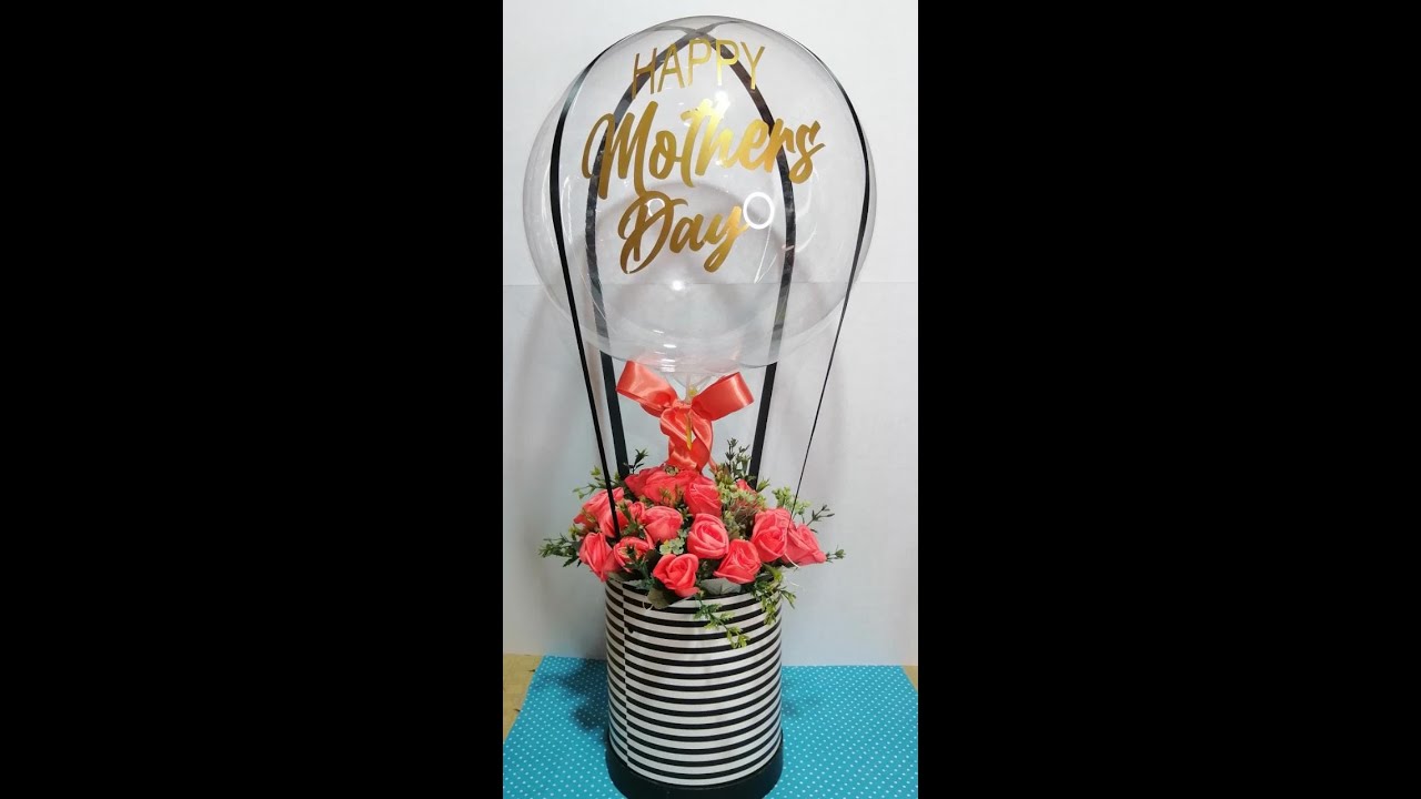 arreglo con globo🎈🎈🎈 burbuja y flores artificiales 💐💐💐💐