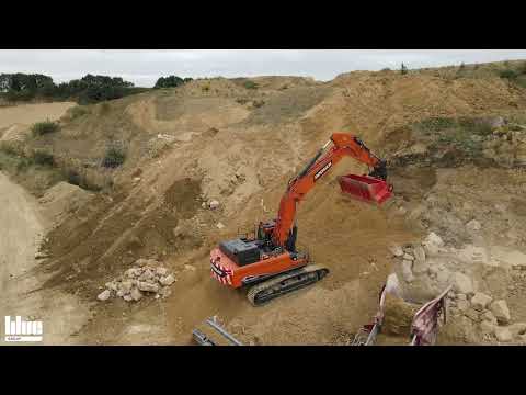 Large Allu Screening Bucket screening overburden in quarry