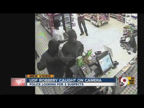 Surveillance footage of armed robbery at local UDF