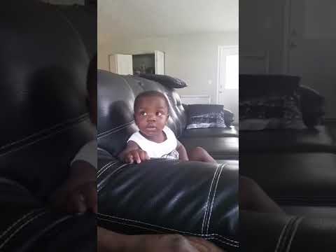 EJ as a baby with his dad