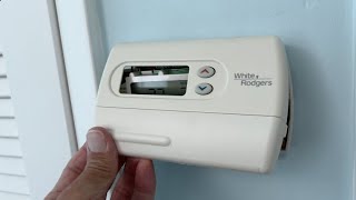 How to remove the cover on a White and Rodgers thermostat