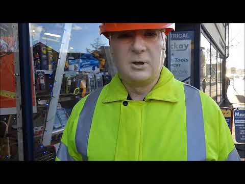 Mannequin-man reprising the role of Dickie Mackay mannequin-man performming as a Living Mannequin: Mannequin-man reprising the role of Dickie Mackay, the Dickies work wear clothing sponsored mannequin that stands outside Mackays in Cambridge through rain shine and snow for Mackays on 29/11/2018