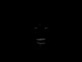 man laughing in the dark