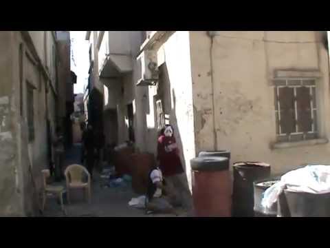 مناورة عناصر كتيبة أسود الإسلام مع أحد قناصي النظام في حي العسالي في دمشق