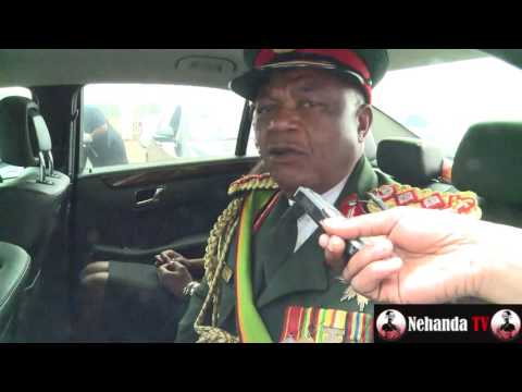 General Constantino Chiwenga speaking to a reporter from his car.