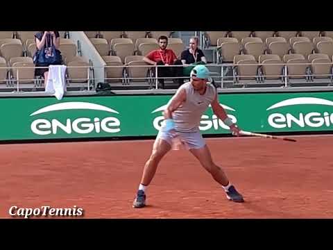 Rafael Nadal Intense Hitting in Roland Garros Sideview 🎾