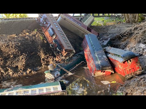 PASSENGER TRAIN CRASHES INTO MUD