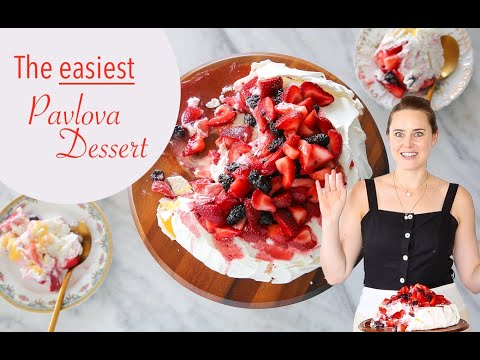 THE BEST PAVLOVA DESSERT RECIPE: This easy pavlova is topped with fresh berries, lemon curd & cream!