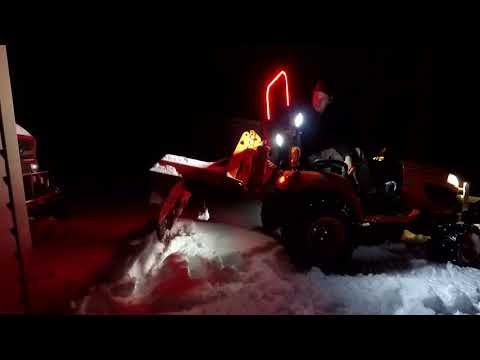 Removing A BX Mid Mount Mower in the snow, then plowing