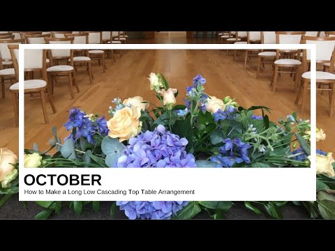 Part of a video titled How to Make a Long Low Cascading Top Table Arrangement in Blue and ...