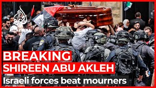 Israeli forces beat mourners carrying Abu Akleh’s body