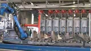 Motoman robot handling moulded clay wash basins