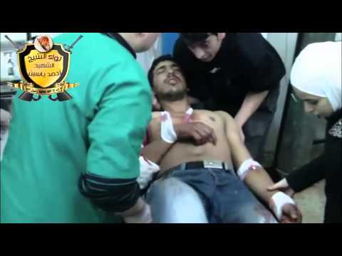 معالجة مصاب من كتيبة نزار الريان في إحدى المشافي الميدانية في مدينة داريا في ريف دمشق