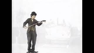 小林住宅 CM 1995年 ネクタイをバイオリンに見立てる