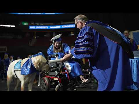 Service Dog Joins Student on Stage at Commencement