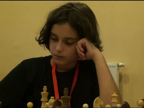 B12 1.1.  Nikolas Theodorou   -  Shamshad  Akhundov ½ - ½