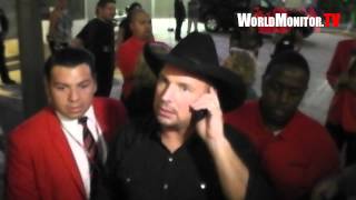 Country legend Garth Brooks surprises a lucky fan leaving Teachers Rock charity benefit