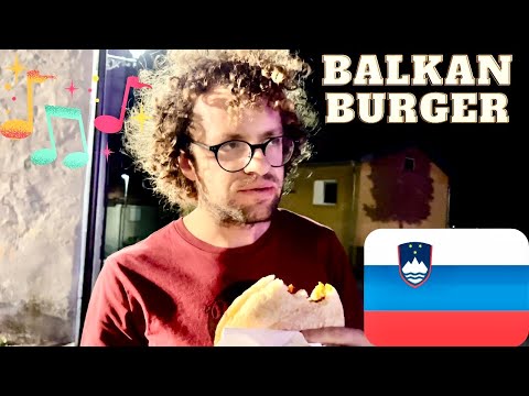 American Trying Slovenian Beer and Pljeskavica, Cerknica Slovenia