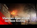Vlammen slaan uit dak van woning in Vlijmen