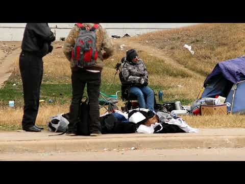 02-13-2021 Fort Worth, TX - locals help the homeless prepare, frozen water garden