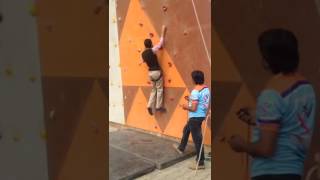 Bilal javaid is climbing a wall, para climber