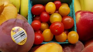A medley of cherry tomatoes, pluots and Pence peaches.