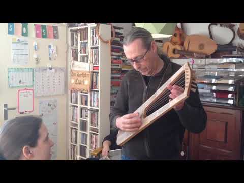 Spike trying out his new Trossingen Lyre (6th century germanic lyre)