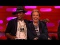 Pharrell competes for the attention of Julie Andrews.