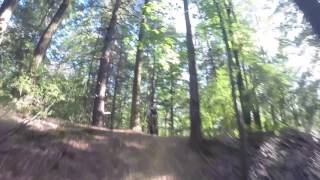 Brandon riding the Mega Pumps Trail's Big Whoops feature at Griffin Bike Park