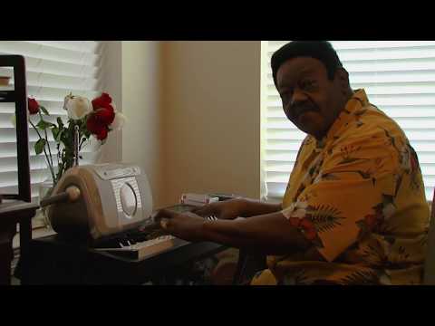 Fats Domino playing piano at home