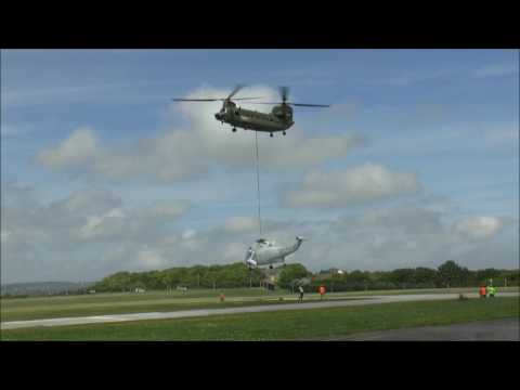 RAF Chinook lifting Royal Navy Sea King Helicopter Air Frame