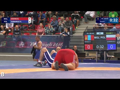 Round 1 FS - 130 kg: B. SHURA (MGL) df. K. DOMARUS (POL) by Injury Default, 2-0