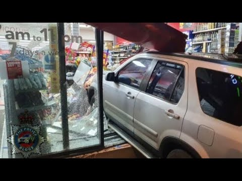 , title : 'Car narrowly misses shoppers as it crashes into store in East Grinstead'