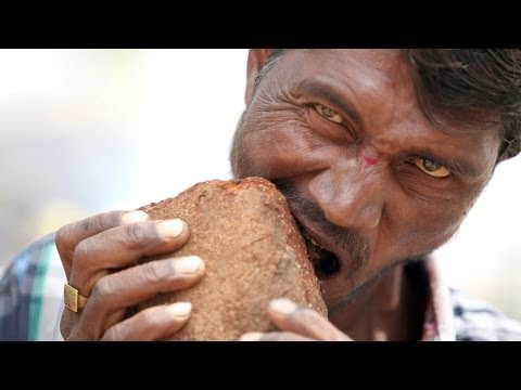 Funny man videos - Man Addicted To Eating Bricks, Mud and Gravel