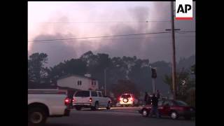 Fire crews flooded the ruins of burning homes with water early Friday after a massive explosion appa