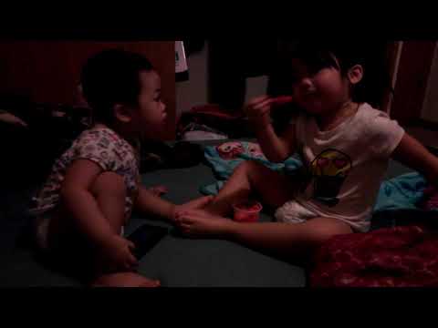 Sharing ice cream with her little sister soraya