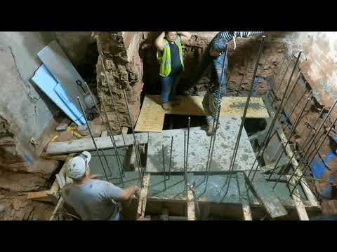 Forming and pouring concrete in elevator shaft