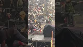 Fan rushes stage at Rage Against the Machine Show Toronto July 23 2022.   Tom Morello gets tackled