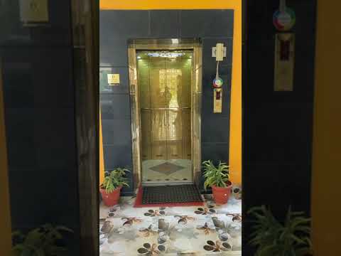 Gold Chrome lift with glass door