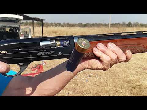 Slow motion semi-auto 12 gauge shotgun shooting