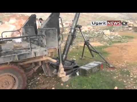 تجهيز مدفع الهاون من قبل عناصر كتيبة مهاجري الشام لضرب مدفعية الزهراء في محافظة حلب