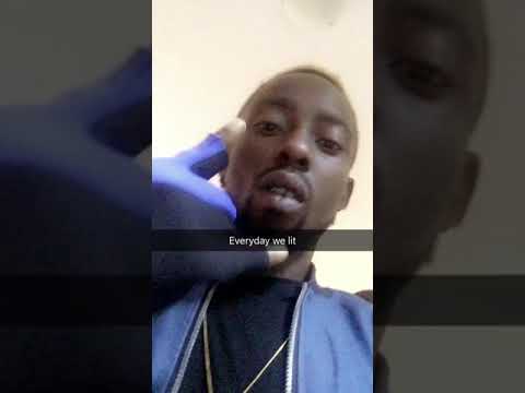 Erigga chilling with a glass of Hennessy real mattes