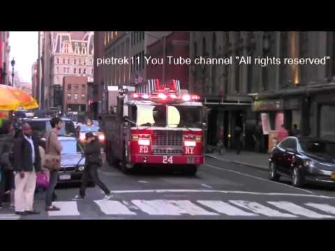 Fire trucks responding FDNY : new Engine 1 & Ladder 24 under perfect Police Officer protection ©