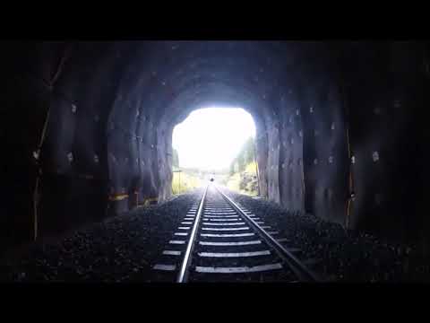 INSIDE TRAIN TUNNEL WHEN TRAIN COMES THROUGH