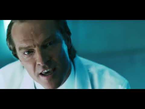 Trailer still: underground lab glass and alarms—credits will slam into Flyleaf’s remix