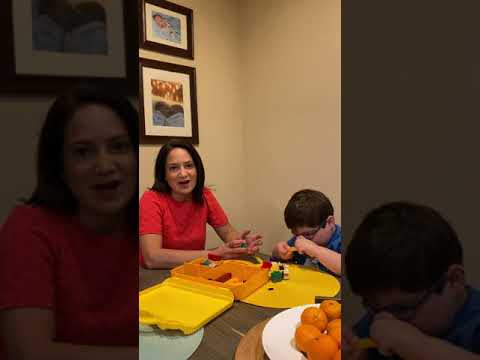 a still shot from the video of Jeanette and Lucas sitting at their kitchen table together